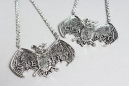 A PAIR OF NOVELTY BAT WINE LABELS.