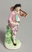 AN 18TH CENTURY DERBY FIGURE OF A VINTNER carrying a barrel over his shoulder.