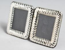 A SMALL PAIR OF SILVER FRAMED PHOTOGRAPH FRAMES 3.5ins x 2.75ins.
