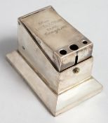 A SILVER RECTANGULAR CIGAR CUTTER with hinged top, London 1903, engraved from Lt. Col. H J. WYATT,