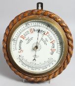 A GOOD OAK CASED CIRCULAR BAROMETER AND THERMOMETER by J. SEWILL, the dial 7.5ins.