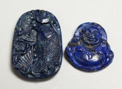TWO CARVED LAPIS PENDANTS.