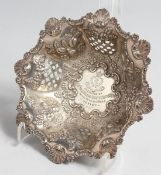 A VICTORIAN PIERCED BON BON DISH with shell mounts, 6ins diameter, Birmingham 1898, maker,