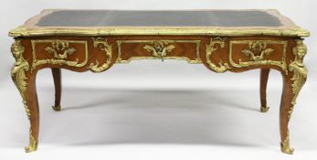 A GOOD LOUIS XVI DESIGN KINGWOOD AND ORMOLU BUREAU PLAT, of shaped outline, with gilt tooled leather