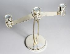 A MODERN THREE LIGHT CANDELABRA on circular base, 10ins high, presented to the Officers Mess, March,