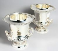 A PAIR OF CAMPAGNA URN SHAPE PLATED WINE COOLERS, 10.5ins high.