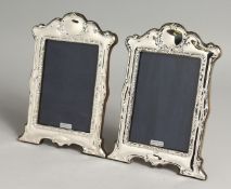 A LARGE PAIR OF SILVER PHOTOGRAPH FRAMES. 19cm x 14cm.