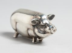 A SILVER PIG VESTA.