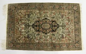 A PERSIAN SILK RUG, beige ground with all over floral decoration. 5ft 6ins x 3ft 8ins