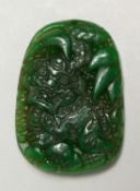 A CHINESE CARVED JADE DRAGON PENDANT, 6cm.