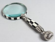 A MAGNIFYING GLASS with CHROME AND CHEQUERED handle..