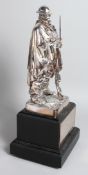 A GOOD WHITE METAL STANDING FIGURE OF A SOLDIER with gun and bayonet. 11.5 ins high, on a square