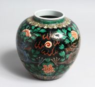 A CHINESE FAMILLE NOIR PORCELAIN JAR. 7ins high.