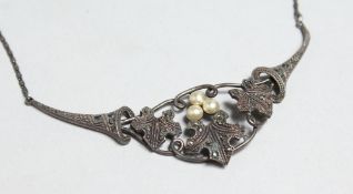 A SILVER, MARCASITE AND PEARL PENDANT AND CHAIN.