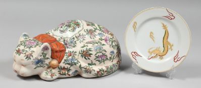 A CHINESE POTTERY CAT and A JAPANESE PLATE. Cat 12ins long, Plate 7ins diameter (2).