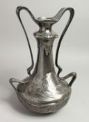 A LARGE W M F. PLATED TWO HANDLED VASE with a young girl's head and scrolling handles. 15ins high.