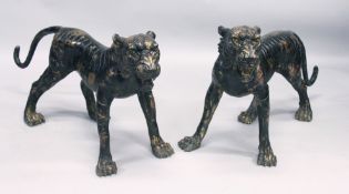 A GOOD LARGE PAIR OF BRONZE PROWLING TIGERS 46ins long.