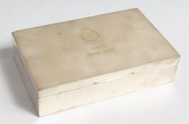 A RECTANGULAR SILVER STERLING CIGARETTE CASE, cedarwood liner, 6.75ins long, inscription, British