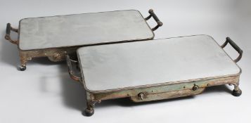 A PAIR OF TWO HANDLED WARMER DISHES.