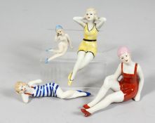 A SET OF FOUR DECO DESIGN PORCELAIN BATHING BEAUTIES.