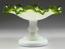 A ViCTORIAN OPAQUE AND TINTED GREEN GLASS FRILLY EDGE COMPORT, the central base stamped with