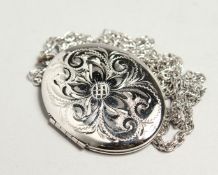 A SILVER OVAL LOCKET AND CHAIN.