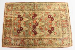 AN UNUSUAL PERSIAN RUG, beige ground, the central panel with vases of flowers. 5ft 8ins x 3ft