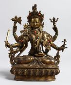 AN EASTERN BRONZE MULTI ARMED DIETY inset with turquoise and coral. 8.5ins high.