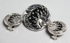 A SILVER AND ONYX CELESTIAL MOON BROOCH AND EARRINGS.