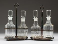 TWO PAIRS OF OIL AND VINEGAR BOTTLES on a plated frame.