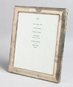 A LARGE SILVER UPRIGHT MENU HOLDER, London 1989, 12ins x 10ins, with inscription, Presented by 217