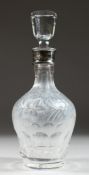 A VERY GOOD CUT GLASS DECANTER AND STOPPERS with fruiting vines and silver band.