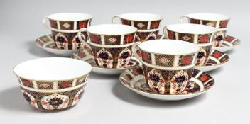 A SET OF SIX LARGE ROYAL CROWN DERBY OLD IMARI PATTERN CUPS AND SIX SAUCERS, NO. 1128 and a spare