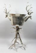 A LARGE WINE COOLER WITH STAG HEAD HANDLES on antler stand, 41ina high.
