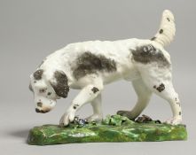 A 19TH CENTURY DERBY FIGURE OF A HOUND.