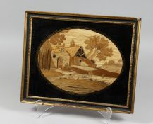 A GEORGIAN OVAL FRAMED AND GLAZED SILKWORK PICTURE of a man fishing with stream, buildings and