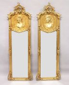A LONG PAIR OF UPRIGHT GILT MIRRORS 5ft 9ins long x 1ft 8ins wide.