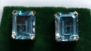 A PAIR OF SILVER EMERALD CUT TOPAZ EARRINGS