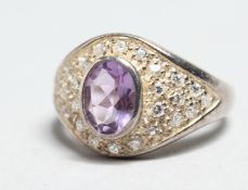 A SILVER AMETHYST AND CZ RING.