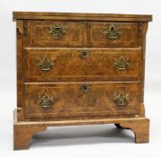 AN 18TH CENTURY WALNUT BATCHELOR'S CHEST with a crossbanded rectangular fold over top, two small