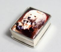 A SILVER PILL BOX, the lid decorated with a dog carrying a basket of kittens.