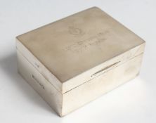 AN OBLONG SILVER CIGARETTE BOX with cedarwood liner. 4.5ins wide with inscription: RAMC OFICERS