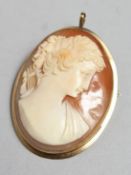 A 9CT GOLD MOUNTED CAMEO BROOCH, 1.75ins high.
