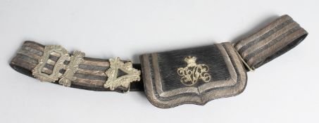 A VICTORIAN MEDICAL OFFICER'S LEATHER AND SILVER EMBOSSED POUCH AND STRAP.