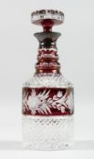 A VERY GOOD CUT GLASS PLAIN AND RUBY DECANTER AND STOPPER with silver band. 11ins high.