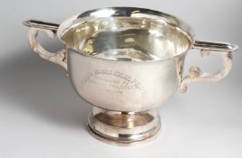 A MASSIVE INDIAN TWO HANDLED CIRCULAR POLO CUP, LUCKNOW, 1925, presented by Perry and Co.,