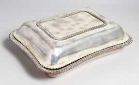A RECTANGULAR ENTRÉE DISH AND COVER with gadrooned edge.