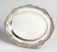 A GEORGE IV SILVER OVAL MEAT DISH with gadrooned and shell border, 17ins long. London 1823, maker R.