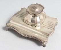 A SMALL SILVER INKSTAND with single bottle and pen well, 6.25ins long, Birmingham, 1906, with RAMC