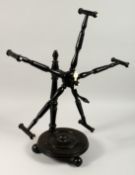 A VERY GOOD 19TH CENTURY SPINNING WHEEL WOOL WINDER with ivory buttons 24ins high.